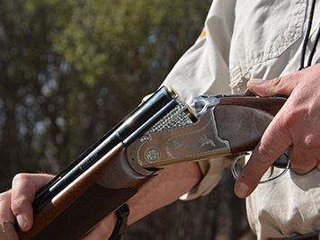 Close-up of an open break-action shotgun